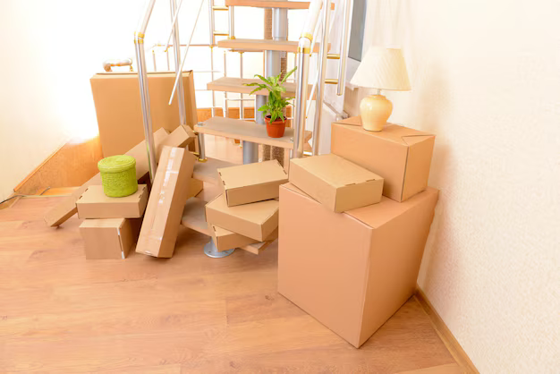stack cartons near stairs moving